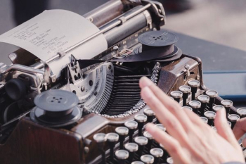 person typing using typewriter person typing using typewriter