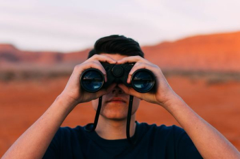 person using binoculars person using binoculars