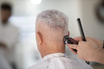 Person Using Hair Razor on Man's Hair Person Using Hair Razor on Man's Hair