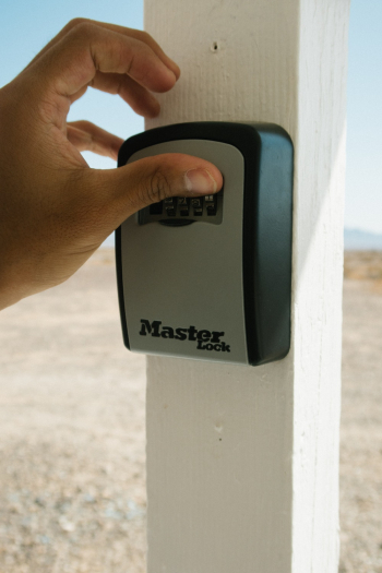 Person Using Master Lock Combination Lock Person Using Master Lock Combination Lock