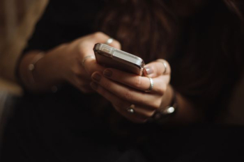 person using smartphone person using smartphone