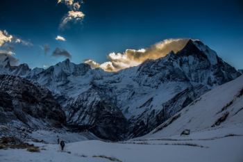 Person Walking in Snow Mountain Person Walking in Snow Mountain
