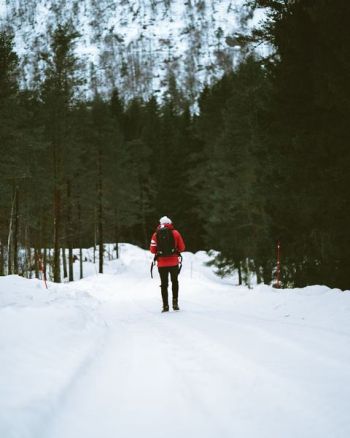 person walking on snow ground person walking on snow ground