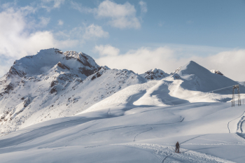 Person Walking On Snow Mountain Person Walking On Snow Mountain