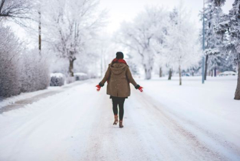 person walking on snow path person walking on snow path