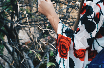 Person Wearing A Floral Top Person Wearing A Floral Top