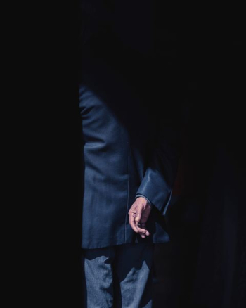 person wearing black formal suit person wearing black formal suit