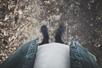 person wearing black shoes person wearing black shoes