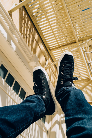 Person Wearing Black Sneakers Person Wearing Black Sneakers