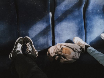 person wearing black sneakers person wearing black sneakers