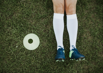 Person Wearing Blue Cleat