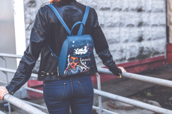 Person Wearing Blue Leather Backpack