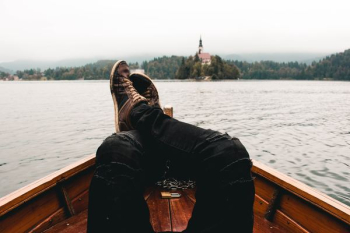 person wearing distressed black jeans on boat person wearing distressed black jeans on boat