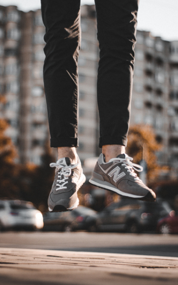 Person Wearing Gray New Balance Shoes Person Wearing Gray New Balance Shoes