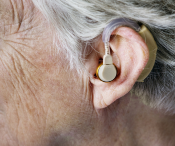 Person Wearing Hearing Aid Person Wearing Hearing Aid