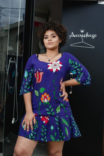 Person Wearing Purple and Green Floral Dress