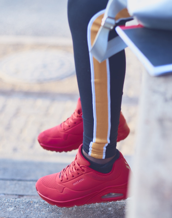 Person Wearing Red Lace-up Athletic Shoes