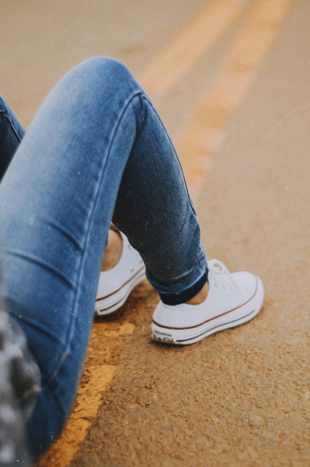Person Wearing Sneakers Person Wearing Sneakers