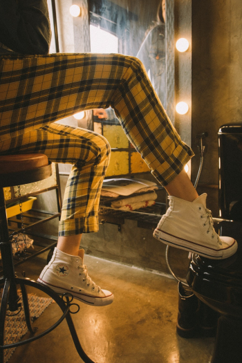 Person Wearing Sneakers Person Wearing Sneakers