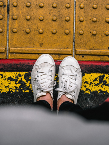Person Wearing Sneakers Person Wearing Sneakers