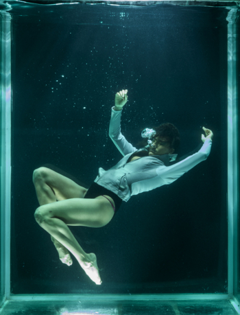 Person Wearing White Long-sleeved Shirt in Underwater Person Wearing White Long-sleeved Shirt in Underwater