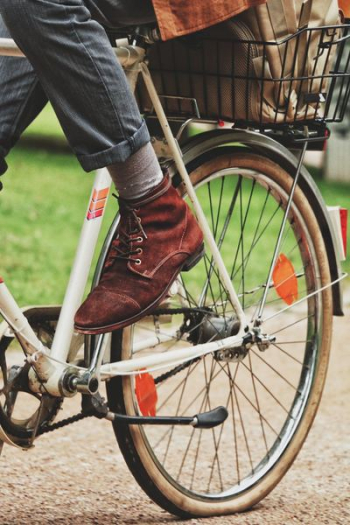 person wears brown suede dress shoe person wears brown suede dress shoe