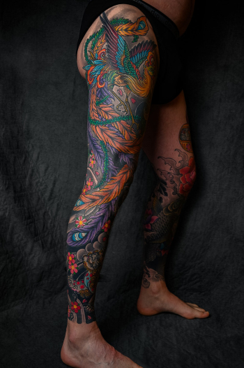 Person With Floral Leg Tattoo Standing Person With Floral Leg Tattoo Standing