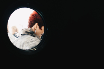 Person With Red Hair Wearing Gray Parka Person With Red Hair Wearing Gray Parka