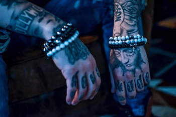 person with tattoos on arms person with tattoos on arms