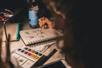 Person Writing Illustration in Spiral Notebook Person Writing Illustration in Spiral Notebook