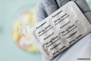 Pharmacist holding paracetamol pain killers Pharmacist holding paracetamol pain killers