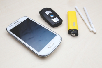 Phone, car key, lighter & cigarettes Phone, car key, lighter & cigarettes