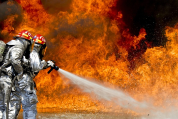 Photo of a 2 Fireman Killing a Huge Fire Photo of a 2 Fireman Killing a Huge Fire