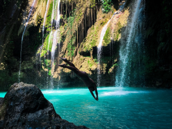 Photo of a Woman Diving into Body of Water Photo of a Woman Diving into Body of Water