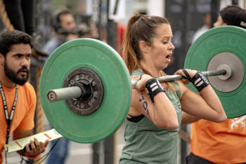 Photo of a Woman Lifting a Barbell Photo of a Woman Lifting a Barbell
