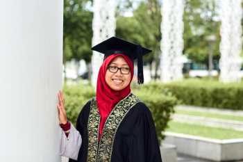 Photo of a Woman Wearing Graduation Gown and Mortar Board Photo of a Woman Wearing Graduation Gown and Mortar Board