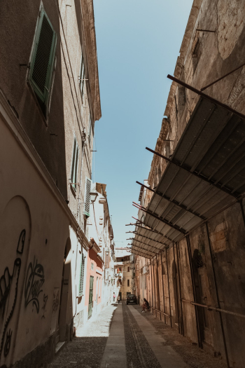 Photo of an Alley Between Buildings Photo of an Alley Between Buildings