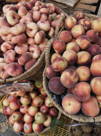 Photo of Apples and Peaches on Wicker Baskets Photo of Apples and Peaches on Wicker Baskets