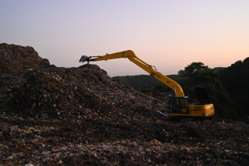 Photo of Backhoe on Landfill Photo of Backhoe on Landfill