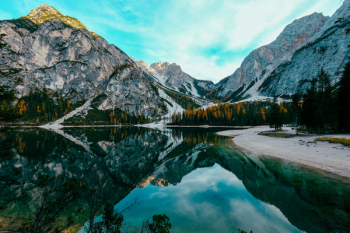 Photo of Beautiful Mountain Scenery Near Body of Water Photo of Beautiful Mountain Scenery Near Body of Water