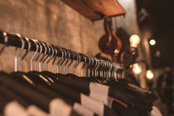 Photo of Black Clothes on Hangers Photo of Black Clothes on Hangers