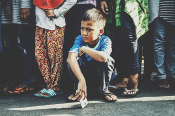 Photo of Boy Holding White Smartphone Photo of Boy Holding White Smartphone