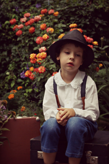 Photo Of Boy Sitting Alone