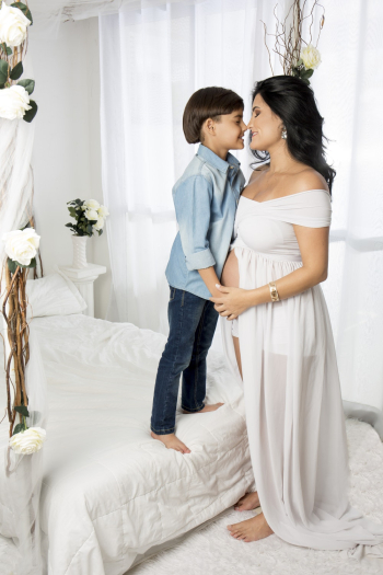 Photo Of Boy Standing Beside Mother