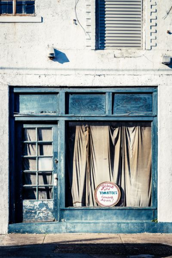 photo of closed store with black door photo of closed store with black door