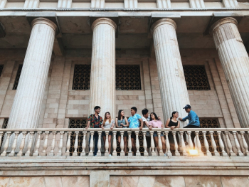 Photo of Couples Standing Near Railings Photo of Couples Standing Near Railings