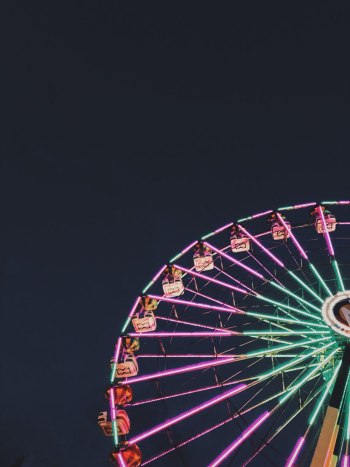 Photo of Ferris Wheel with Neon Lights at Night Photo of Ferris Wheel with Neon Lights at Night