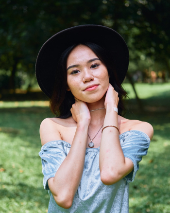 Photo of Girl Wearing Off-Shoulder Top and Black Hat Photo of Girl Wearing Off-Shoulder Top and Black Hat