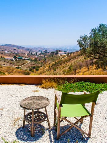 Photo of Green and Brown Folding Chair Near Wicker Table