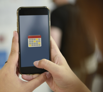 Photo of iPhone Showing Calendar Logo Photo of iPhone Showing Calendar Logo